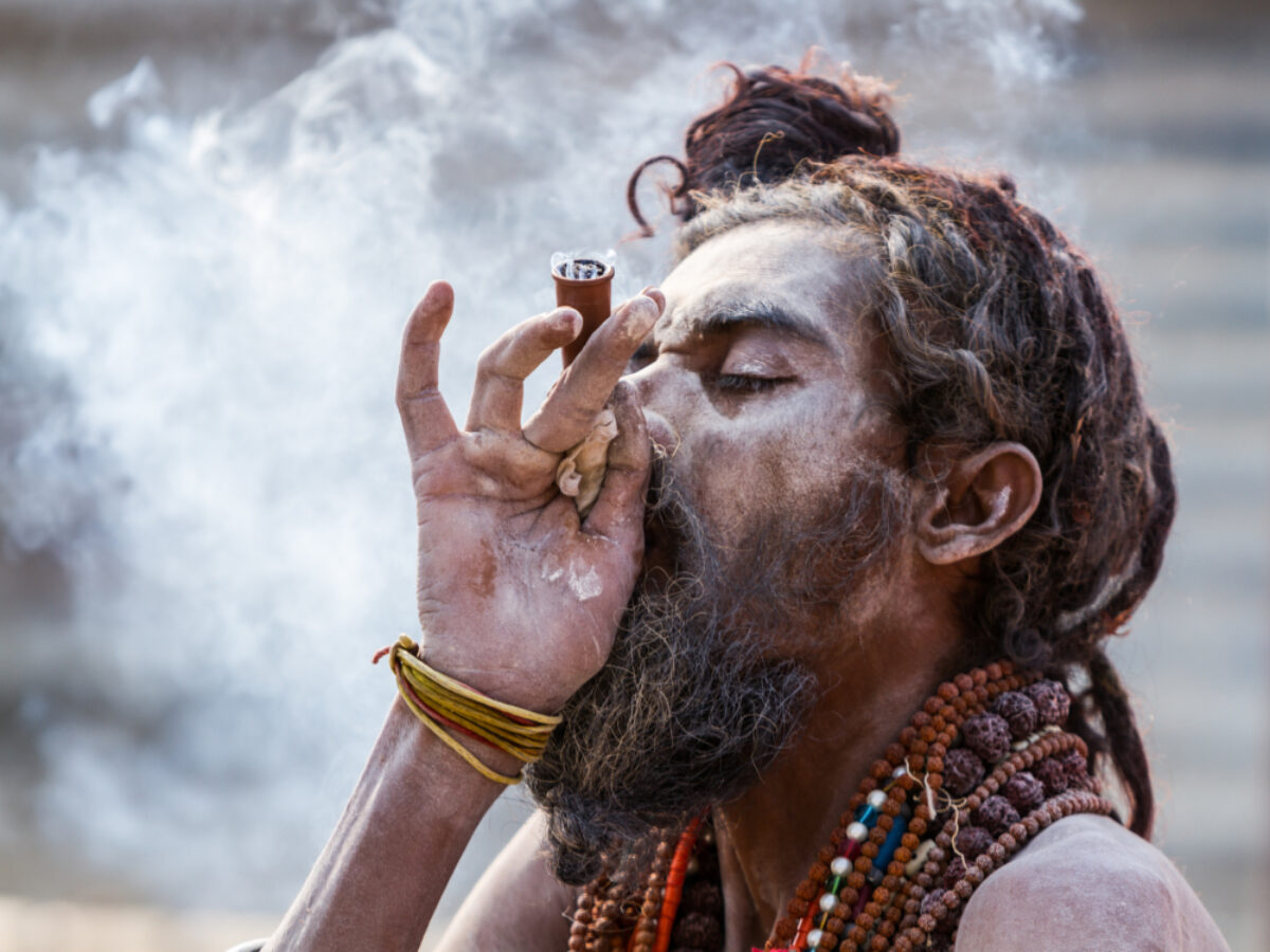 India Allahabad A Hindu sadhu smokes a hash pipe during the festival of Kumbha Mela