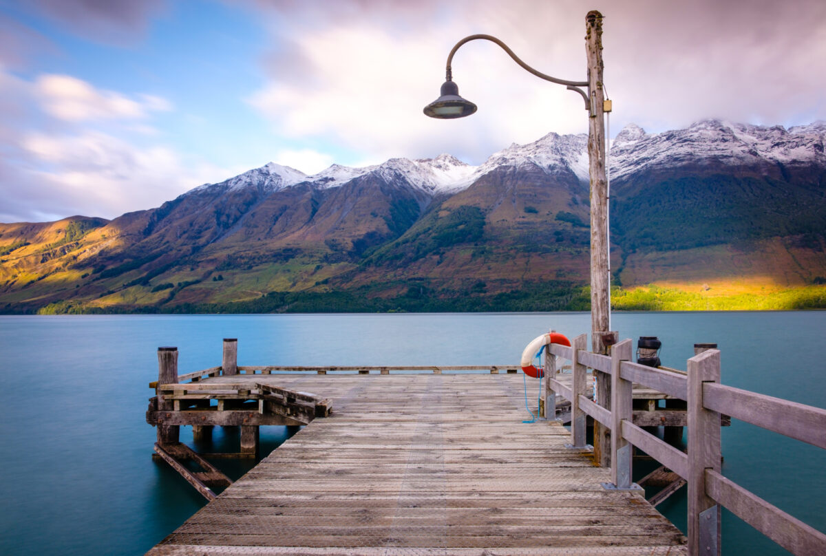 NZ Glenorchy wharf wooden pier and lamp after sunrise