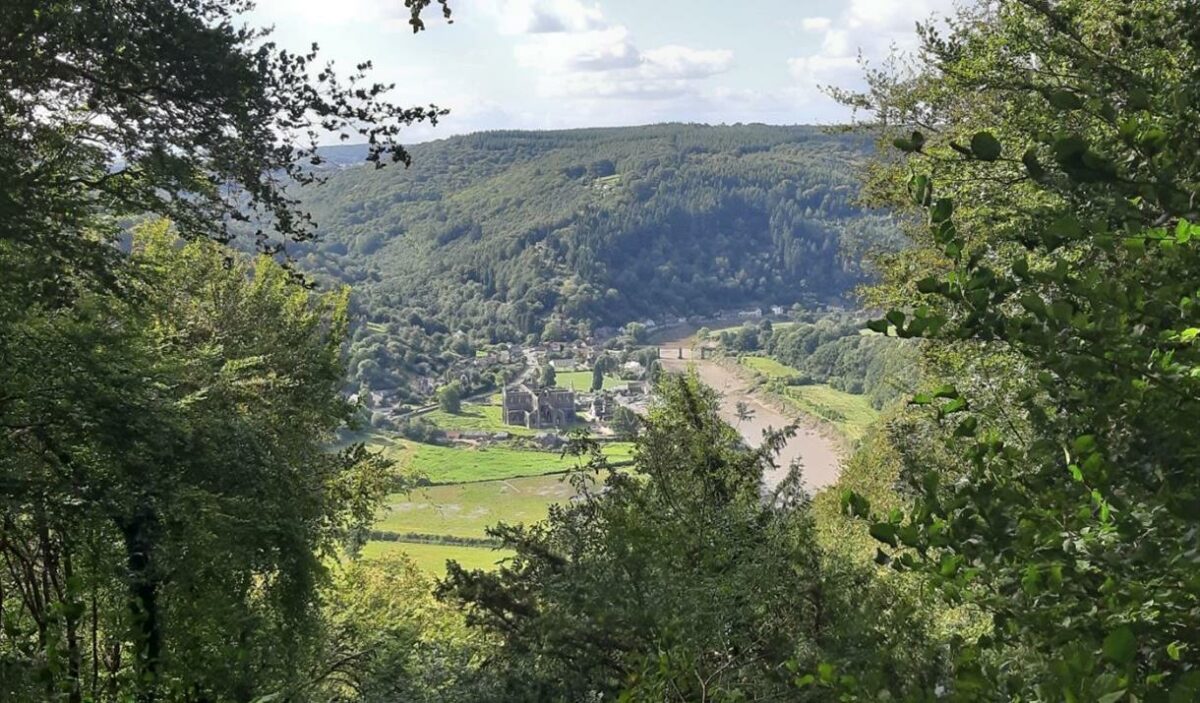 Offas Dyke walk river Wye view of Tintern Abbey from Devils Pulpit Wales UK