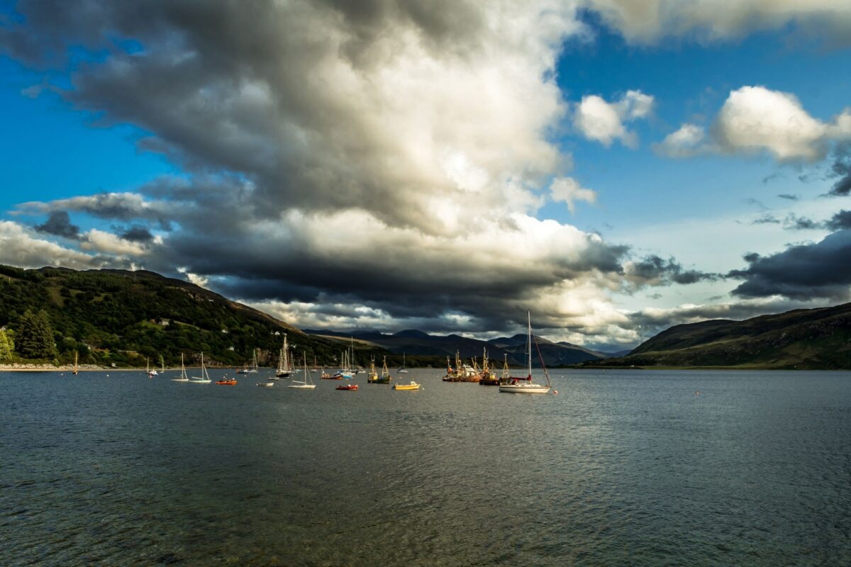 Old Weathered Fishing Boats Anchored In The Harbor Of Ullapool At Loch Broom In Scotland UK