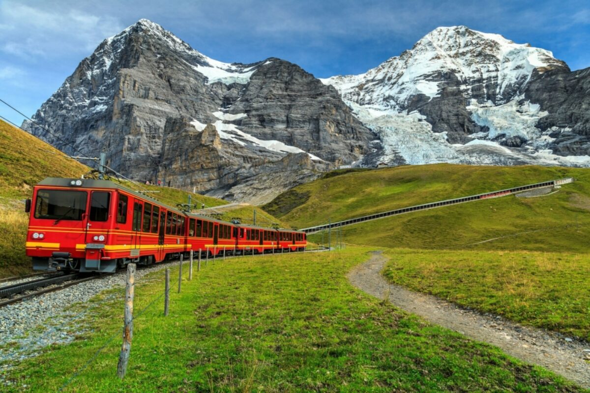 Red train travelling down from Jungfrauloch