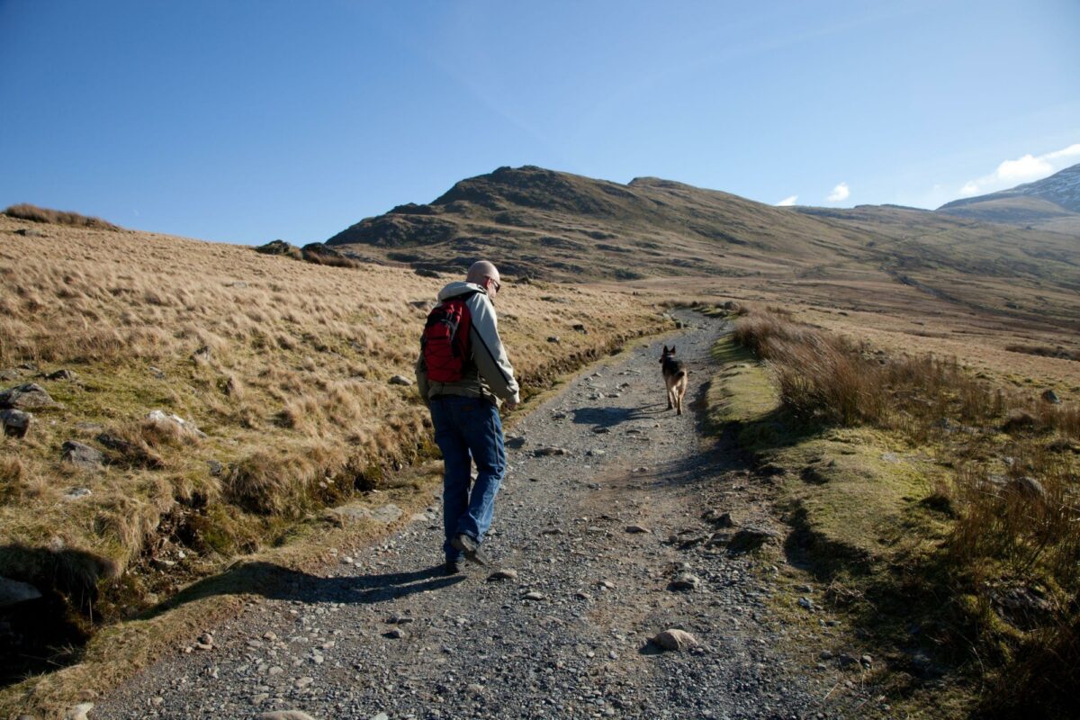 Wales Snowdonia Llanberis path towards Snowdon man walking