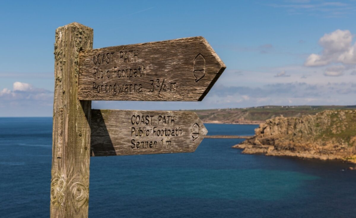 Wooden signpost on the coast of Cornwall England UK