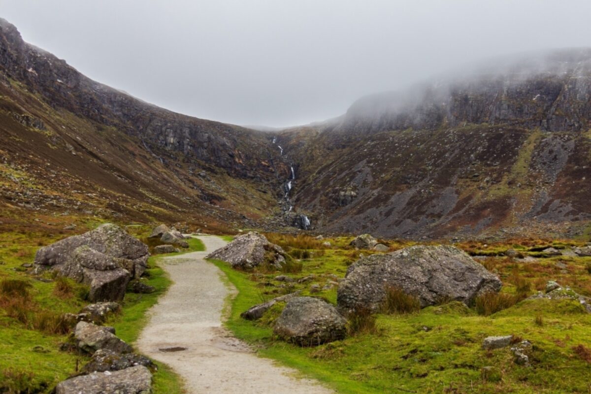 Path winding through a boulder strewn valley leading to Mahon Falls in Waterford County Ireland